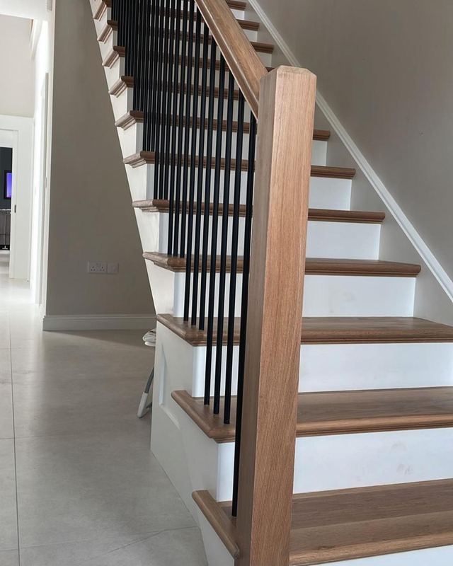 White oak staircase — Steel spindles · oak handrail and newel